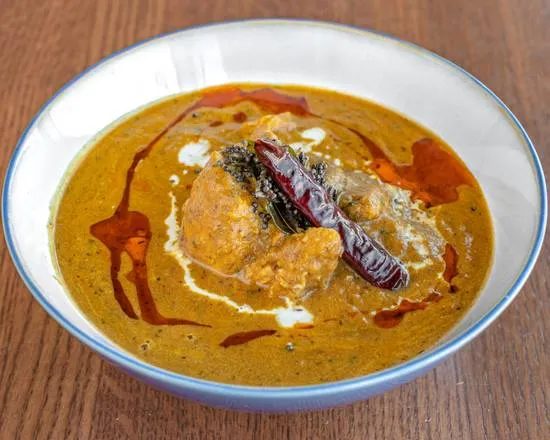 Doro Wat Ethiopian slow-cooked chicken stew with berbere and boiled egg at Merkato Restaurant Winnipeg