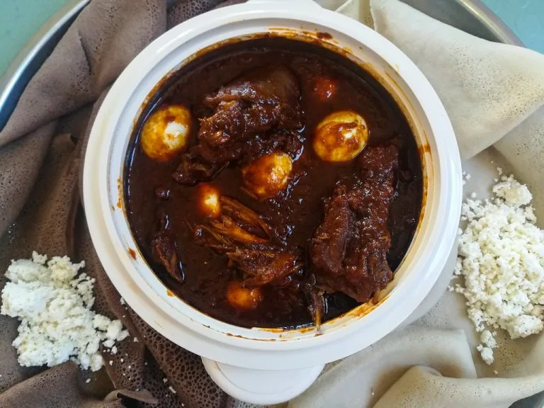 Doro Wat Ethiopian slow-cooked chicken stew with berbere and boiled egg at Merkato Restaurant Winnipeg